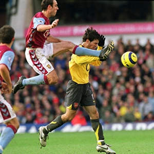 Fabregas vs McCann: A Battle of Midfield Maestros at Villa Park, 2005