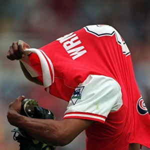Ian Wright (Arsenal) takes off his shirt