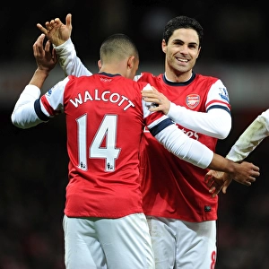Mikel Arteta congratulates Theo Walcott (Arsenal) on his cross for Olivier Girouds 1st goal