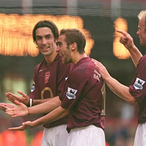 Robert Pires celebrates scoring Arsenals goal from the penalty spot with Matthieu Flamini