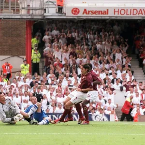 Robert Pires scores Arsenals 1st goal past Mike Pollitt (Wigan)