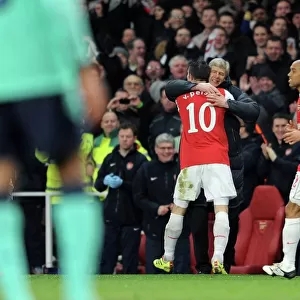 Robin van Persie celebrates scoring Arsenals 1st goal with Arsenal Manager Arsene Wenger