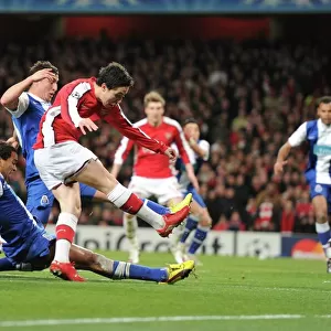 Samir Nasri shoots past Porto goalkeeper Helton to score the 3rd Arsenal goal