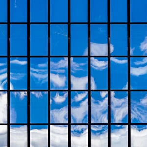 The sky reflected in a glass-fronted building in Wellington, New Zealand