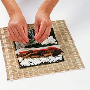 1 - Place a lightly toasted nori sheet on a bamboo mat