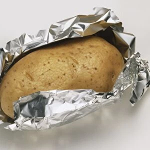 Baked potato in foil and in paper towel