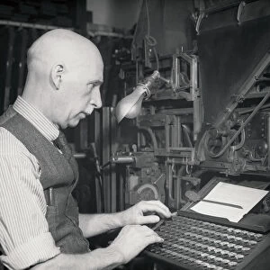 black and white portrait of man typing