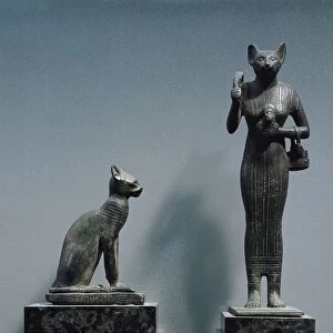 Bronze figurines of goddess Bastet, as a cat or a cat-headed woman
