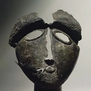 Bronze masque of male deity, from sanctuary of Montserie