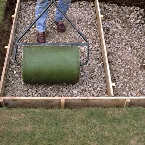 Building a patio, tamping down hardcore using a roller