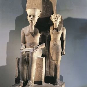 Calcite sculptural group portraying pharaoh Tutankhamen standing beside enthroned god Amon from Thebes, New Kingdom, Dynasty XVIII