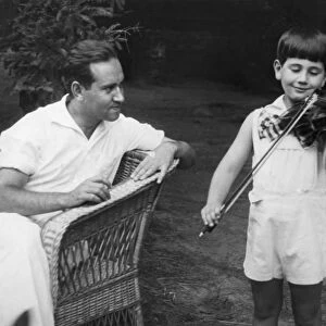 David oistrakh, professor of the moscow state conservatory and laureate of international contests, listening to the playing of his son at his country residence near moscow, september 1938