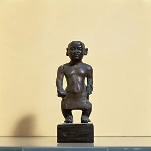 Egyptian civilization. Wooden statue of a dwarf