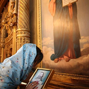 Faithful touching an icon in St Stephens Bulgarian church