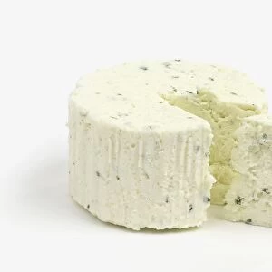 Fresh Boursin cheese with a piece cut away