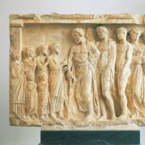 God Asclepius accompanied by his children before a family of devotees, votive marble relief