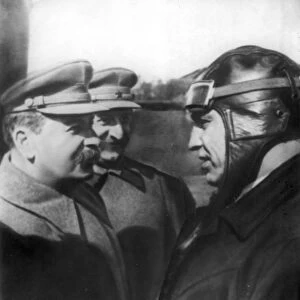 J, v, stalin and sergo ordzhonikidze talking with soviet flyer v, p, chkalov at moscow central airdrome, may 1935