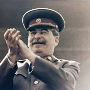 Joseph stalin applauding the red army during a may day parade in red square in 1949