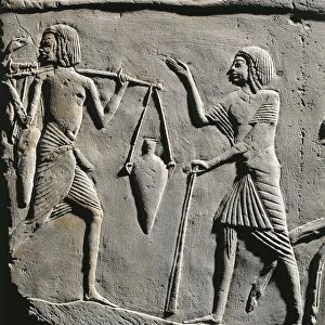 Life in a military camp: water bearer receiving orders from an officer, relief from the tomb of Horemheb at Saqqara. Detail