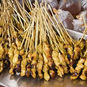 Malaysia, Marang, Chicken on skewers at market stall, close-up