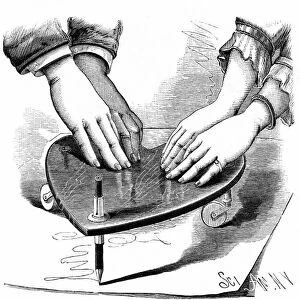 Planchette or Ouija board, 1885. Method of using the Planchette for spirit writing during a seance