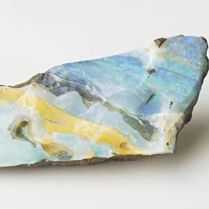 Precious opal, ironstone matrix with streaks of yellowish potch opal, close up