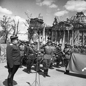 Red army victory ceremony in front of ruined reichstag (chancery) building, berlin, germany, may 1945