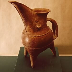 Red ceramic tripod jug from Weifang, China, 3rd millennium B. C