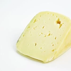 Slice of Italian Italico cows milk cheese