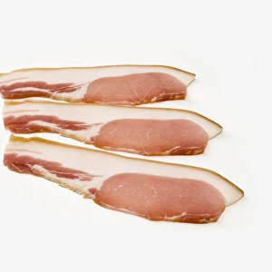 Three slices of smoked bacon, close-up