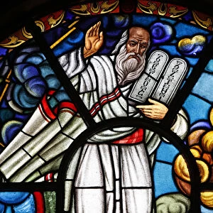 Stained glass window depicting Moses holding the Commandments