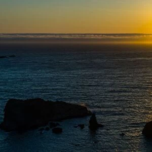 Sunset of sea stacks of rocks Oregon Coast line