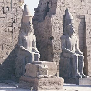 Temple of Luxor, pylon of Ramses II, two colossal statues of the king