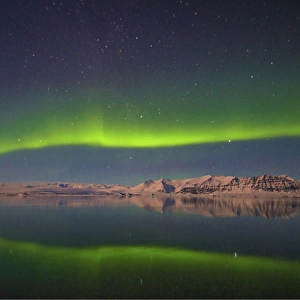 The dramatic Aurora Borealis in the night sky at Jokulsarlon, southern Iceland