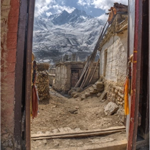 Looking out a temple doorway in Karkhot Jompa to the mountains, Mustang, Nepal