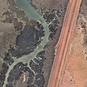 Train tracks crossing an estuary