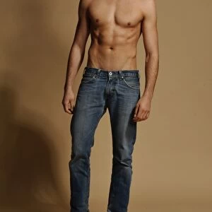 Bare-chested man in jeans