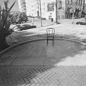 Empty chair in patio by intersection
