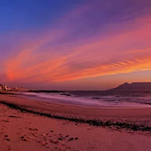 Dramatic Pink Sunset over Table Mountain from Blauwbergstrand Beach, Cape Town, Western Province, South Africa