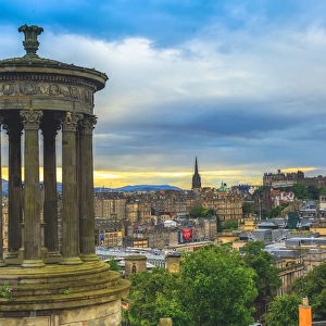 Dugald Stewart Monument with the view of Edinburgh city at dusk