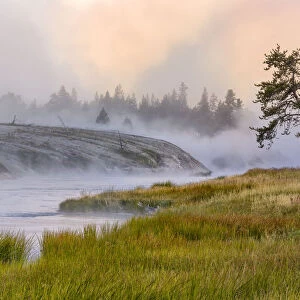 Firehole River in fog at sunrise, Yellowstone National Park, Wyoming, USA