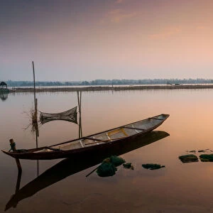 Lonely boat in lagoon / river landscape
