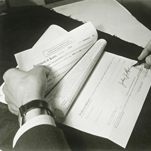 Man signing lease, close up of hands