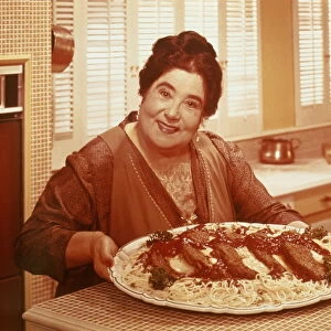 OBESE, ITALIAN WOMAN WITH PLATE OF PASTA