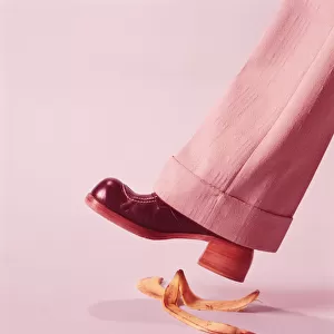 Person about to step on banana skin