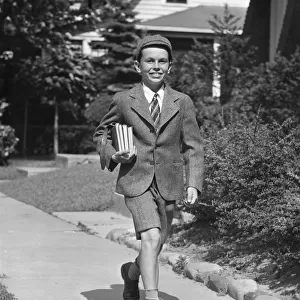 Schoolboy on sidewalk