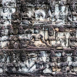 Stone Carving of Figures on a Wall In Angkor Wat