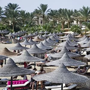 Sun umbrellas on a beach of Marsa Alam, Egypt