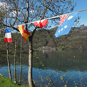 View Of Lake Orta With International Flags In The Foreground