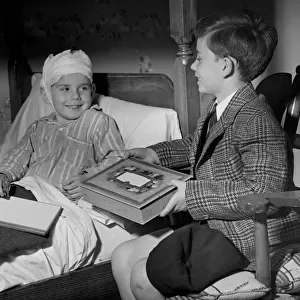 Young boy visiting sick friend